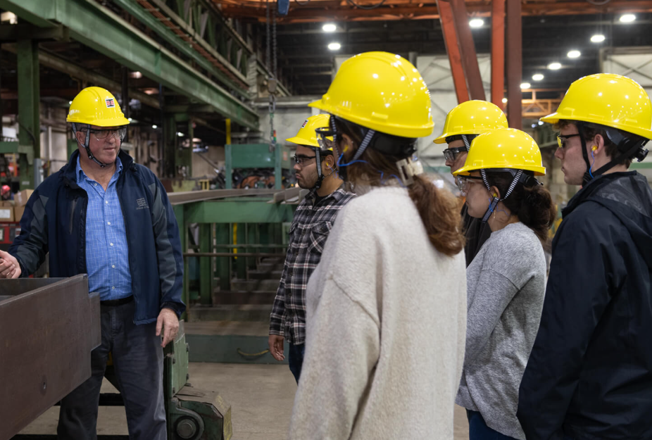 people in construction hats on job site 